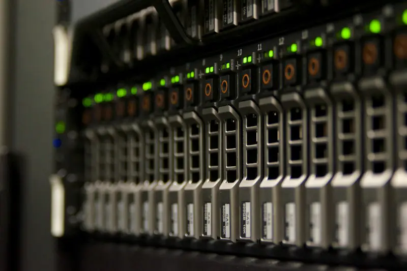 Server drives with green status lights in a rack
